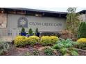 Exterior shot of the Cross Creek Cafe featuring lush, mature landscaping around the building at 102 Adrian Nw Pl, Atlanta, GA 30327