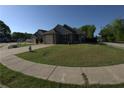 Charming home with a well-manicured lawn, sidewalk, and adjacent street view at 2362 Glebe Ct, Hampton, GA 30228