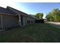 Well-kept lawn featuring flower boxes, professional landscaping, with a view of the street at 2362 Glebe Ct, Hampton, GA 30228