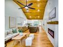 Open-concept living space featuring a fireplace, hardwood floors, and modern kitchen at 3244 Mount Olive Rd, Atlanta, GA 30344