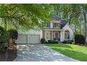 Beautiful two-story home featuring stone accents and an attached two-car garage at 4414 Aldenham Nw Way, Suwanee, GA 30024