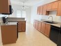 Bright kitchen with wood cabinets, light countertops, tile floors, and stainless steel appliances at 2575 Rosehill Circle, Lithia Springs, GA 30122