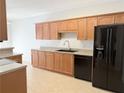 Well-lit kitchen featuring ample wood cabinetry, stainless steel appliances, and light countertops at 2575 Rosehill Circle, Lithia Springs, GA 30122