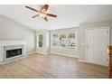 Spacious living room features a fireplace, natural light and neutral paint at 1900 Foster Trace Ct, Lawrenceville, GA 30043
