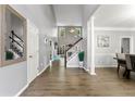 Bright foyer with hardwood floors, staircase, and high ceilings at 3889 Elm Trace Dr, Loganville, GA 30052