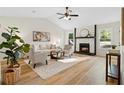 Bright and inviting living room with vaulted ceilings, modern decor, and a cozy fireplace at 9347 Haley Ct, Jonesboro, GA 30238