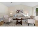 Inviting living room with vaulted ceilings, modern furnishings, and natural light at 9347 Haley Ct, Jonesboro, GA 30238