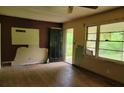 Empty room with hardwood floors and an open doorway at 4758 Highway 81, Mcdonough, GA 30252