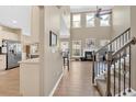 Bright living room with fireplace, large windows, and hardwood floors at 706 Woodland Pl, Woodstock, GA 30188