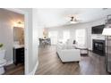Bright living room features a fireplace, modern furniture, and an open floor plan at 1546 Silvaner Nw Ave # 20, Kennesaw, GA 30152
