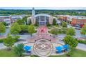 Aerial view of the town center with buildings, landscaping, and streetscape at 3932 Boston Common St, Suwanee, GA 30024