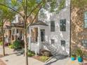 Beautiful exterior showcasing a charming townhome with manicured landscaping and stylish facade at 3932 Boston Common St, Suwanee, GA 30024