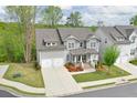 Charming two-story home featuring a two-car garage, well-manicured lawn, and inviting front porch at 412 Nickajack Retreat Ln, Smyrna, GA 30082