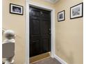 Entryway with a stylish black door, number 9, and decorative artwork at 880 Glendale Ne Ter # 9, Atlanta, GA 30308