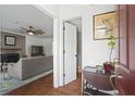 Inviting foyer with hardwood floors that leads into a living room with fireplace at 1 James River Ne Pl, Atlanta, GA 30342