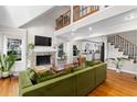 Spacious living room showcasing a stone fireplace, hardwood floors, and an open layout at 1326 Metropolitan Se Ave, Atlanta, GA 30316