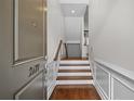 Inviting entryway with hardwood floors and staircase leading to the upper level at 2171 W Village Se Ln, Smyrna, GA 30080