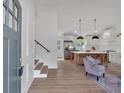 Open-concept kitchen with stainless steel appliances, large island, and stylish pendant lighting at 2637 Crestdale Se Cir, Atlanta, GA 30316