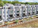 An aerial shot of modern townhomes showcasing the beautiful design and outdoor spaces with lush greenery at 443 Plateau Nw Pl, Atlanta, GA 30309