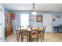 Cozy dining room featuring a wooden table with seating for six and lots of vintage decor at 45 Hunters Ridge Ct, Covington, GA 30014