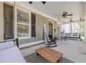 Spacious porch offers swing seating, ceiling fans, and ample space for relaxing and entertaining at 498 Trip St, Grayson, GA 30017