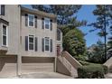 Stylish two-story townhouse featuring a two-car garage and a charming entrance with steps at 2518 Oakwood Se Way, Smyrna, GA 30080