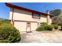 Exterior view of a two-story home with a brick chimney and paved driveway at 3670 Whirlaway Dr, Decatur, GA 30034