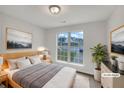 Bright bedroom with a large window and neutral decor at 7240 Raintree Loop, Jonesboro, GA 30236