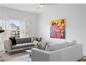 Stylish living room features a grey sofa, bright couches, and modern art for a vibrant and inviting space at 108 Vinings Forest Se Cir, Smyrna, GA 30080