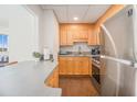 Open kitchen with stainless steel appliances, bar seating, and modern cabinetry at 215 Piedmont Ne Ave # 1110, Atlanta, GA 30308