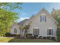 Well-manicured lawn and landscaping highlight this two-story home, creating a welcoming curb appeal at 4310 Wellbrook Ct, Douglasville, GA 30135