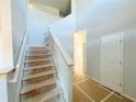 Bright foyer with unfinished staircase and high ceilings, awaiting personalized finishes at 66 Pine Creek Ct, Dallas, GA 30157
