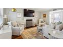 Bright living room boasts a fireplace, plush seating, stylish decor, and natural light at 1226 Haven Brook Ne Way, Brookhaven, GA 30319