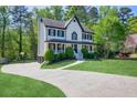 A charming two-story home with a driveway and a beautiful front lawn at 1420 Midland Way, Lawrenceville, GA 30043