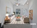 Bright living room with neutral tones, vaulted ceilings, modern furnishings, and a decorative ceiling fan at 5763 Mitchell Chase Trl, Mableton, GA 30126