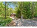 Secluded cabin nestled in the woods, featuring a private driveway and natural surroundings at 4288 Post Rd, Winston, GA 30187