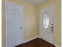 Inviting foyer with hardwood floors and two doors, one with decorative glass at 4699 Ballew Dr, Powder Springs, GA 30127