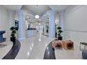 Opulent building lobby with elegant columns, modern decor, and a terrazzo floor at 860 Peachtree Ne St # 1010, Atlanta, GA 30308