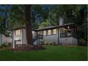Charming exterior elevation featuring a garage and landscaped front yard at 1753 Detroit Nw Ave, Atlanta, GA 30314