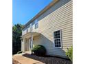 This view shows the home's covered entry and well-manicured landscaping at 1960 Dakota Nw Dr, Acworth, GA 30101