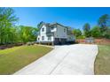 Charming two-story home with wide driveway and spacious garage at 5138 Price Dr, Suwanee, GA 30024