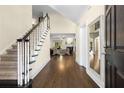 Grand foyer featuring hardwood floors, elegant staircase, and open access to the living areas at 1020 Burton Ne Dr, Atlanta, GA 30329