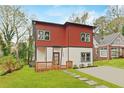 Charming home with a combination of red and white siding, complemented by a cozy front porch and stepping stone path at 2166 Belvedere Sw Ave, Atlanta, GA 30311