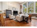 Bright living room featuring hardwood floors, tall windows, exposed brick and stylish decor at 978 North Ne Ave # 207, Atlanta, GA 30306