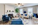 Bright living room featuring fireplace, sofa, modern furniture and lots of natural light at 2121 Silva Ct, Conley, GA 30288