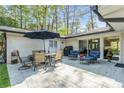 Outdoor patio set with shade umbrella, perfect for relaxation and entertaining guests at 2590 Hawthorne Ne Pl, Atlanta, GA 30345