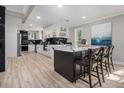Bright kitchen with an island, granite countertops, a wine rack, and modern appliances at 2806 Chaucer Sw Dr, Atlanta, GA 30311