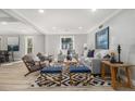 Bright living room featuring recessed lighting, modern furniture, and a stylish geometric rug at 2806 Chaucer Sw Dr, Atlanta, GA 30311
