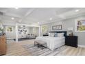 Spacious main bedroom featuring recessed lights, wood floors, and a sitting area at 2806 Chaucer Sw Dr, Atlanta, GA 30311