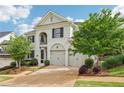 Lovely two-story home with a well-maintained lawn and a two-car garage at 4025 Connolly Ct, Roswell, GA 30075